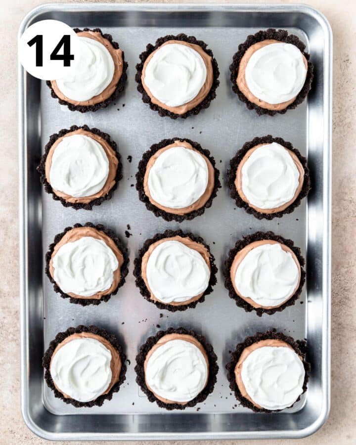 topping set chocolate mousse with whipped cream.