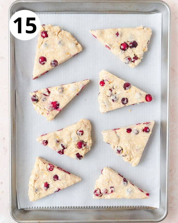 cranberry scones on baking sheet.