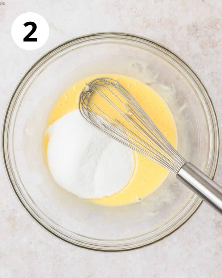 adding sugar to batter.