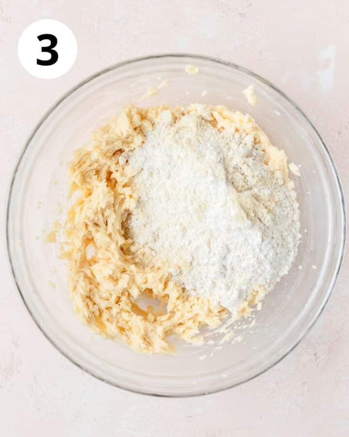 adding dry ingredients to dough.