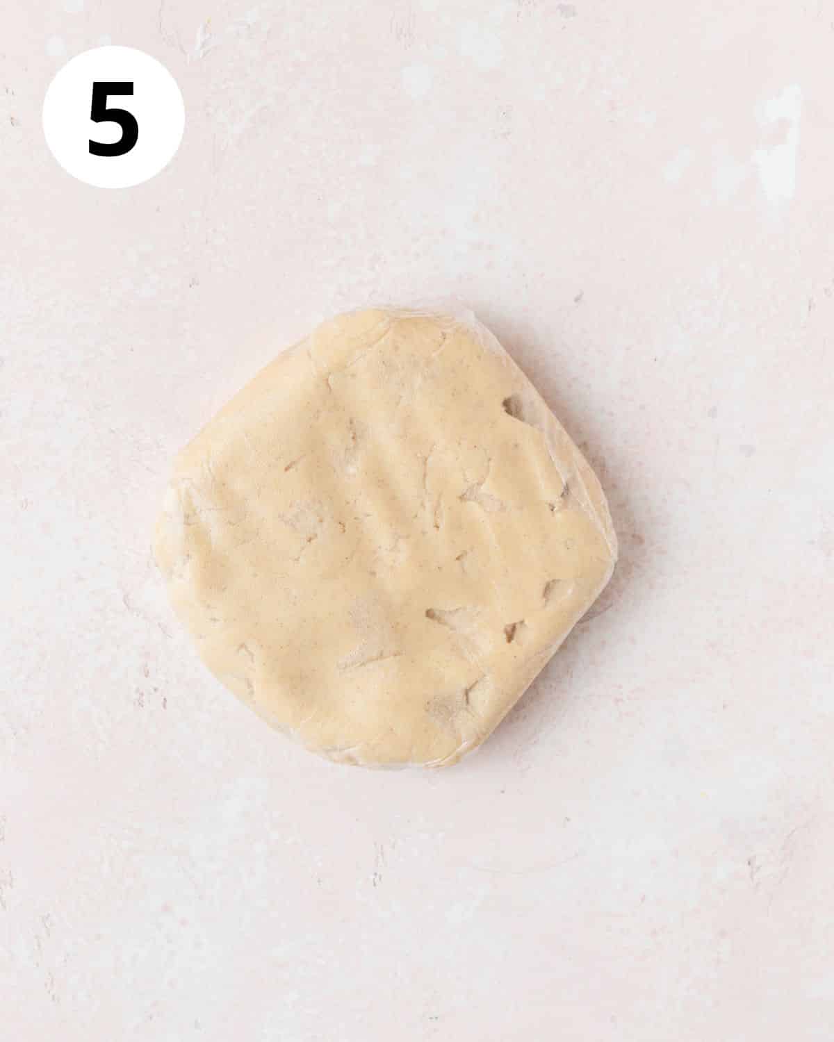 cookie dough wrapped in plastic to chill.