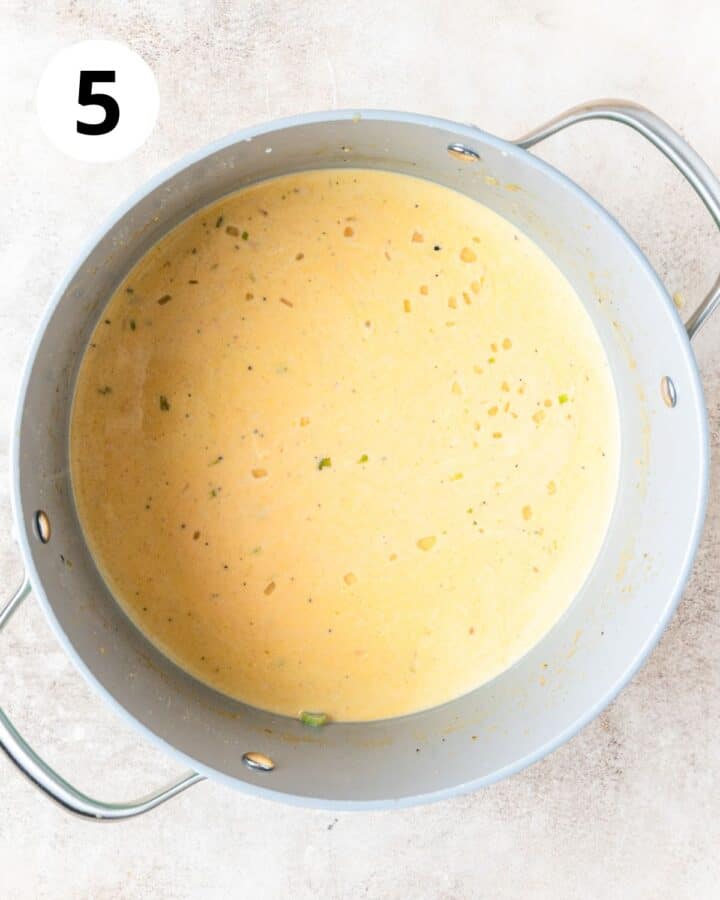 adding cream to soup.