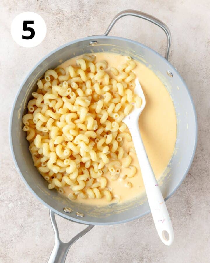 adding cooked pasta to sauce.