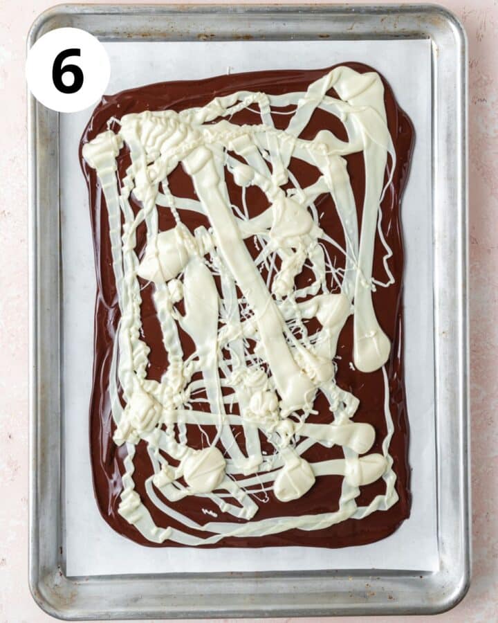 pouring white chocolate over top.