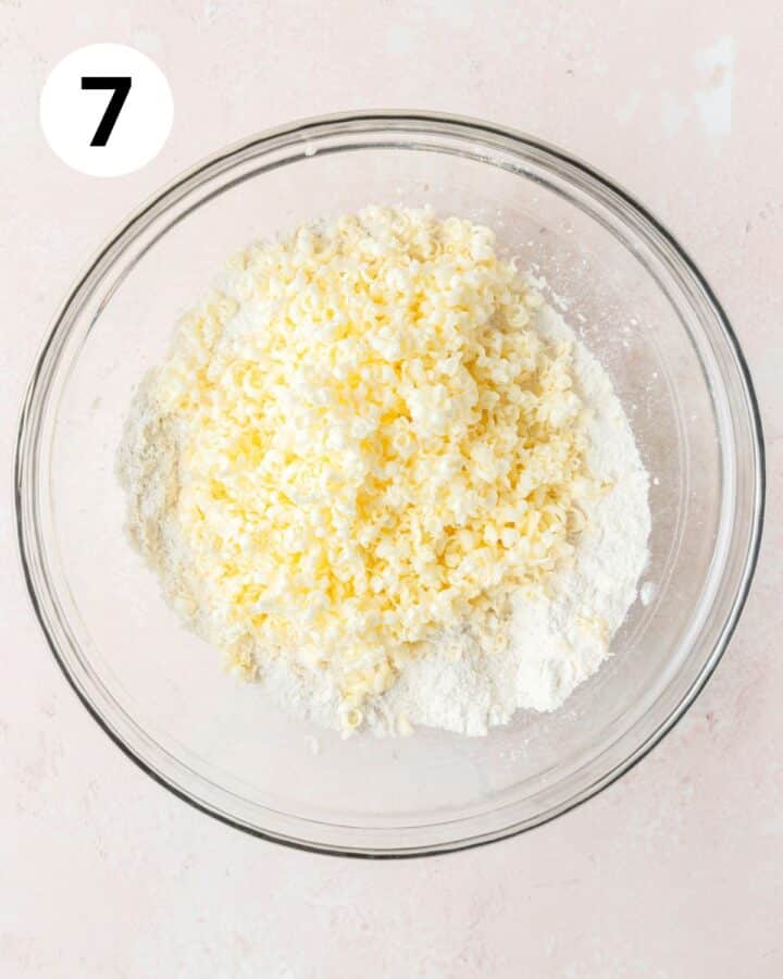adding frozen butter to dry ingredients. 