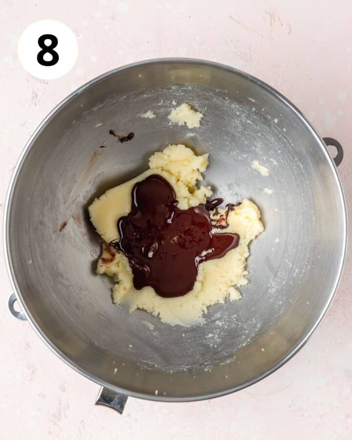 adding melted chocolate to sugar and butter.