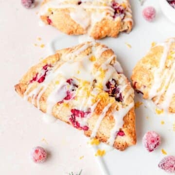 fresh cranberry orange scones with orange glaze.