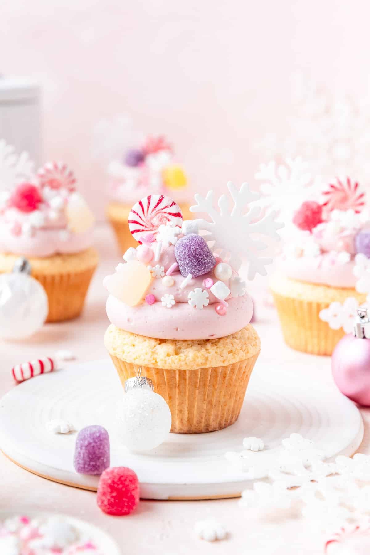 sugar plum fairy cupcakes topped with candy.