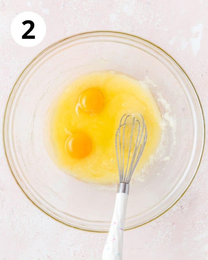 adding eggs to batter.