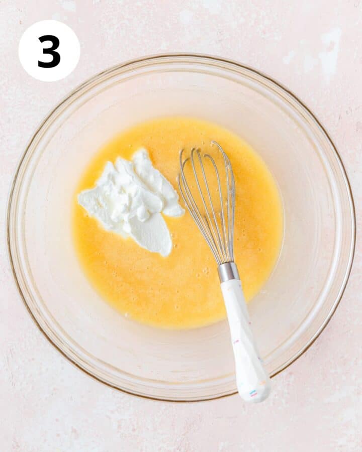 adding sour cream to cupcake batter.
