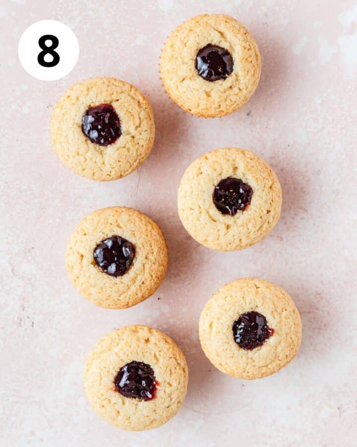 filling cupcakes with plum jam.