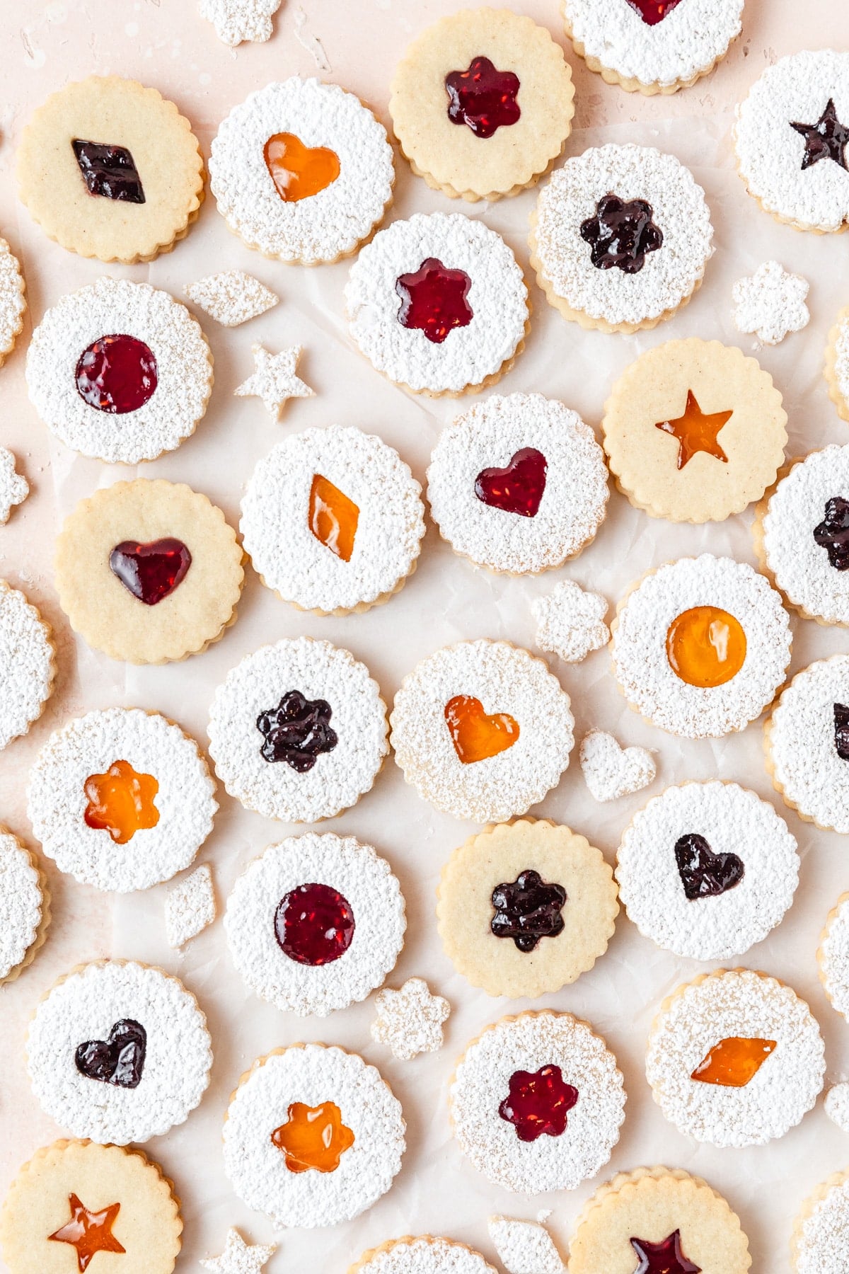 classic linzer cookies filled with different types of jam.