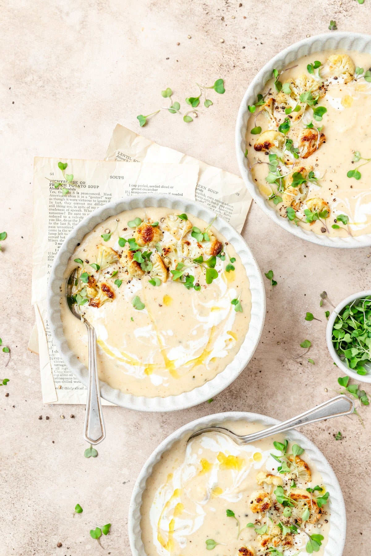 roasted garlic and cauliflower soup topped with microgreens.