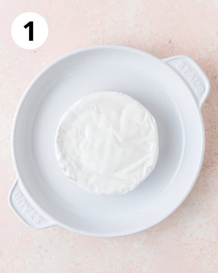 wheel of brie in brie baker.
