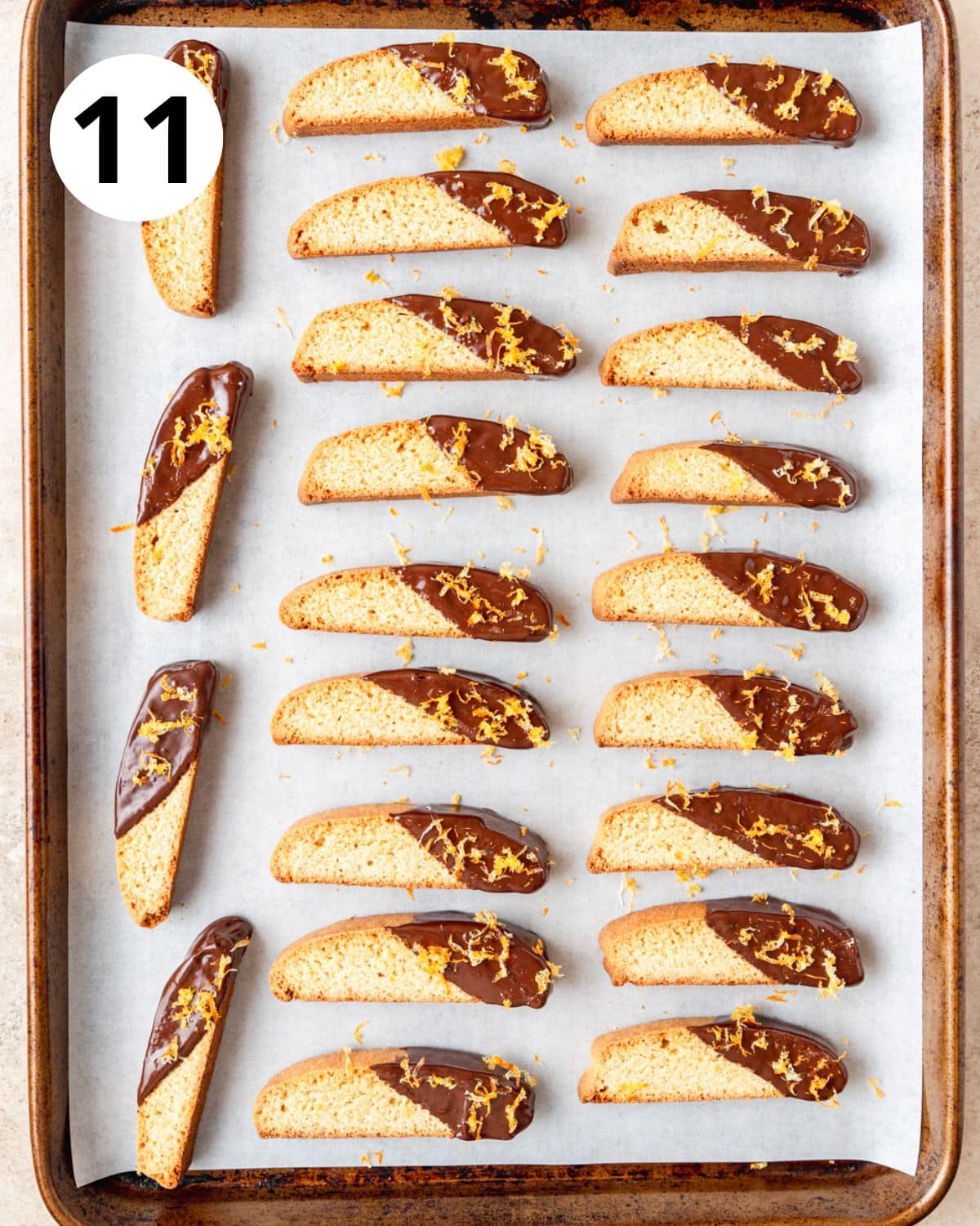 orange biscotti after being dipped in dark chocolate.