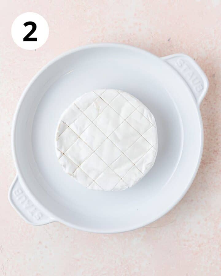 wheel of brie scored on top.