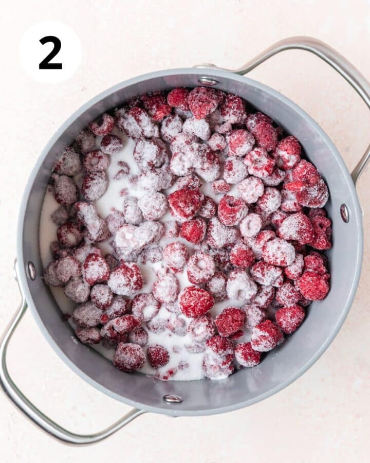 adding sugar to raspberries.