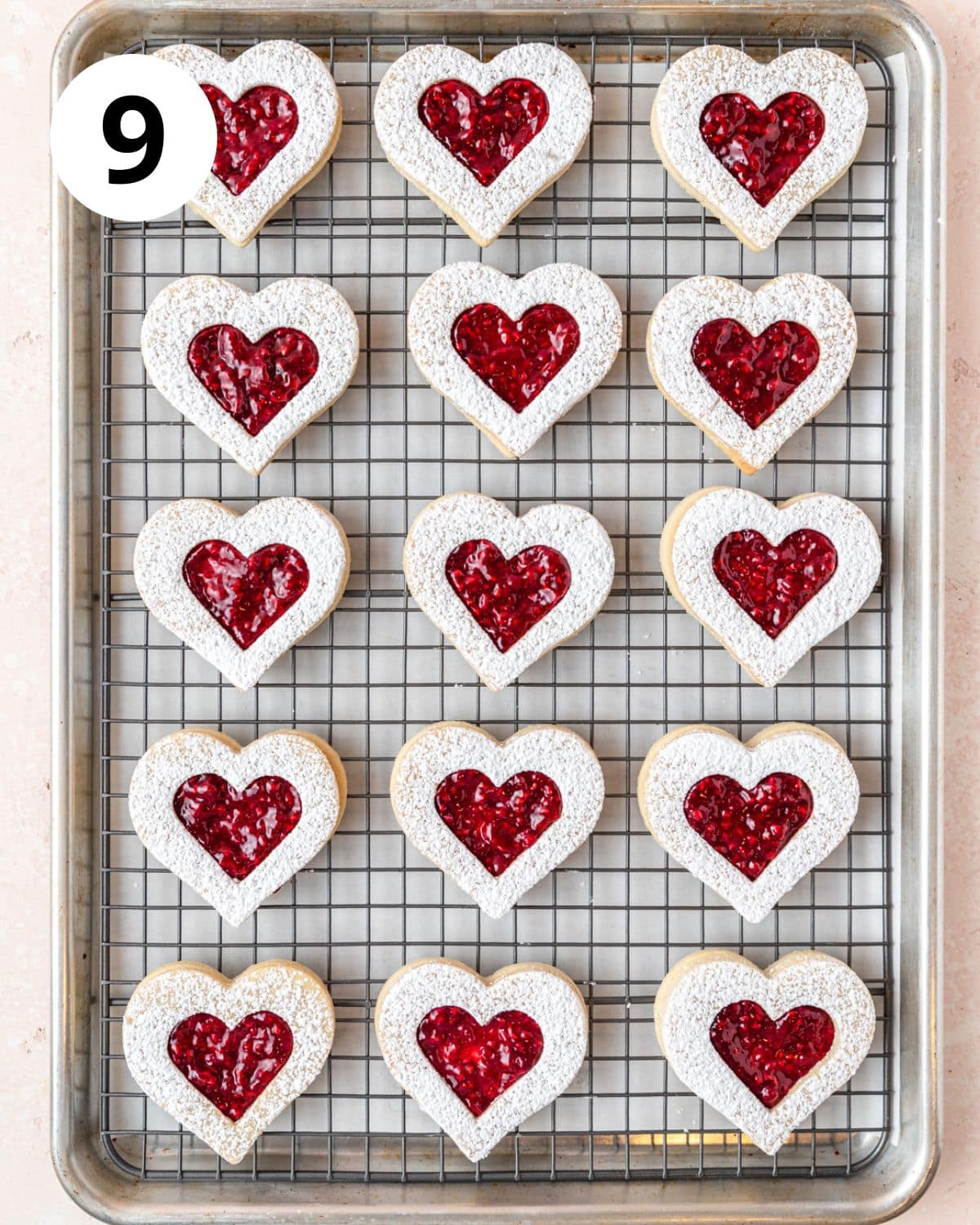 assembled heart shaped linzer cookies.