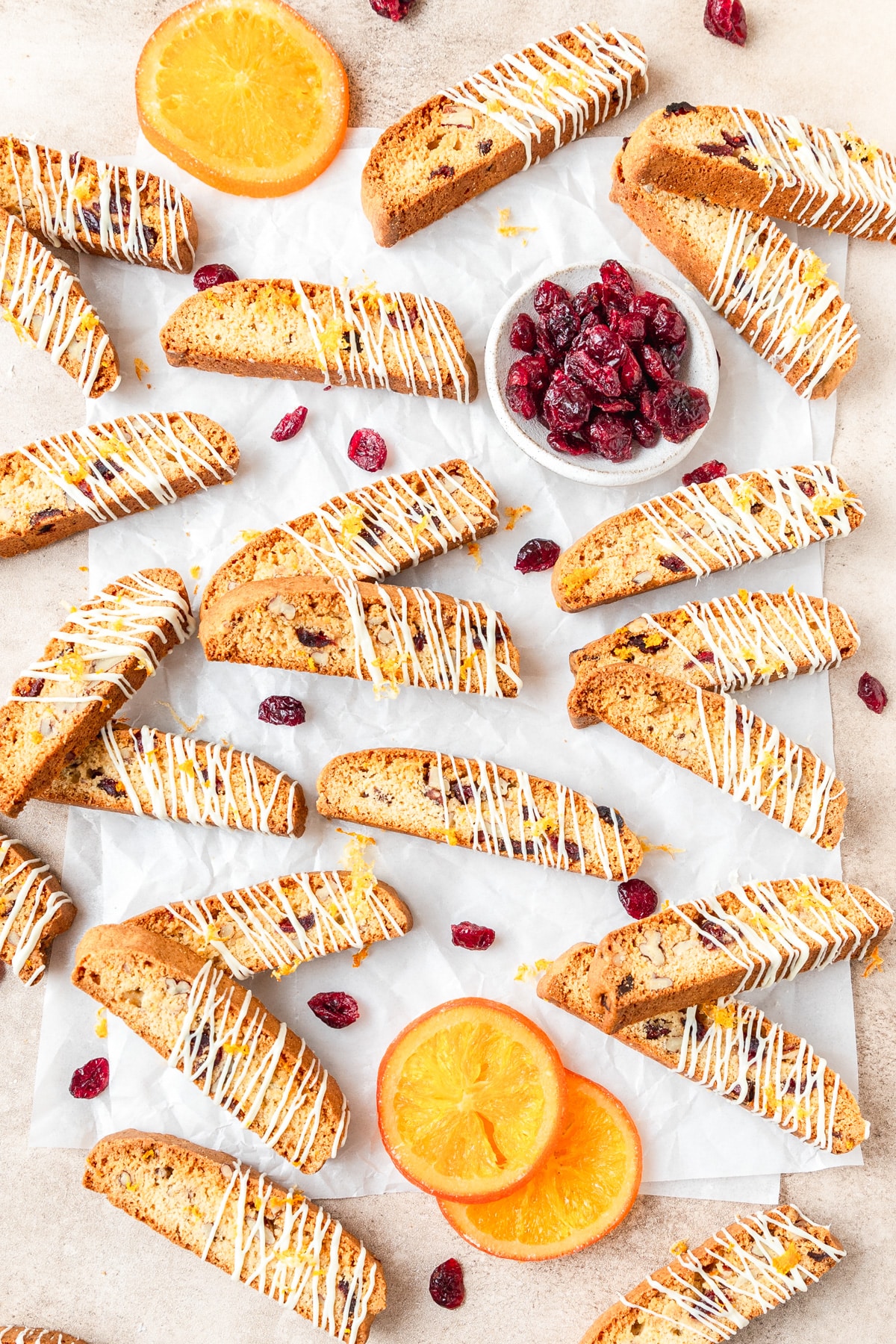 cranberry orange biscotti drizzled with white chocolate.