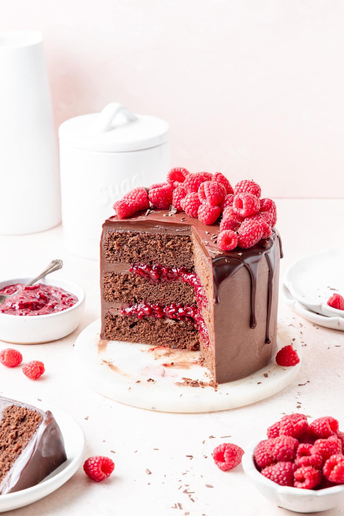chocolate raspberry layer cake topped with fresh raspberries. 