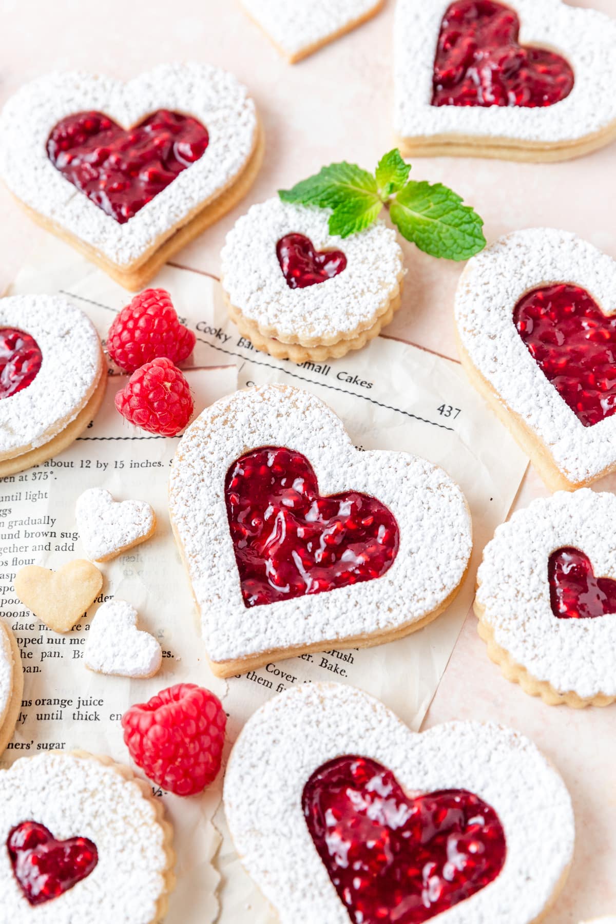 raspberry linzer cookies shaped like hearts.
