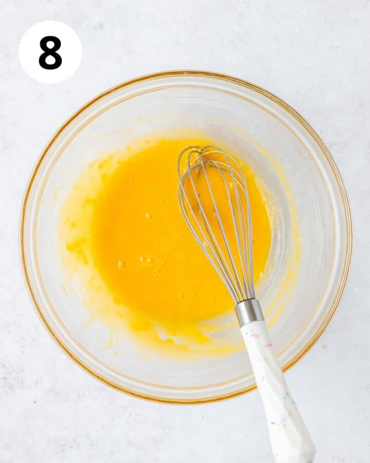 whisking egg yolks and lemon zest together. 
