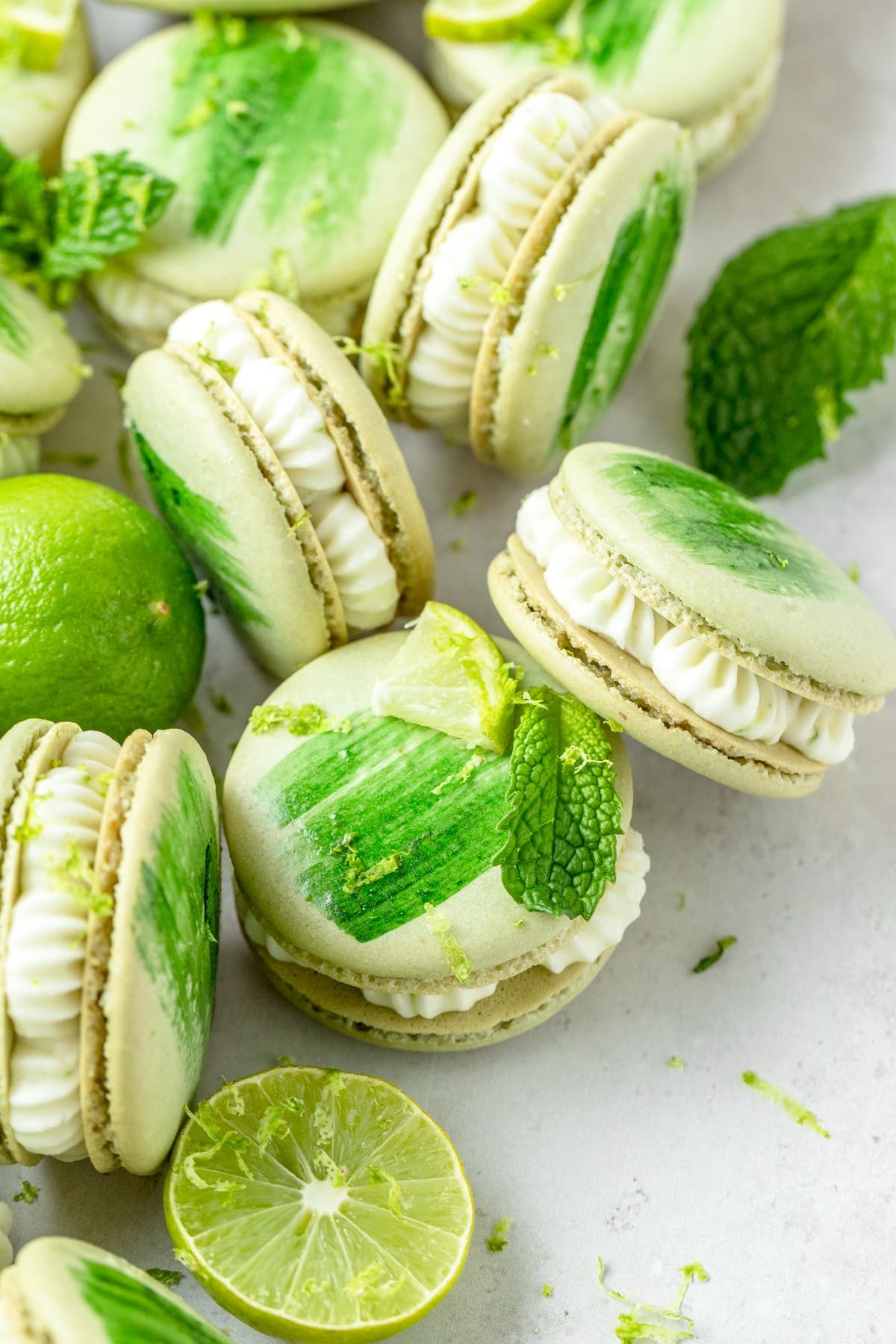 mojito macaron with green food coloring painted on top.