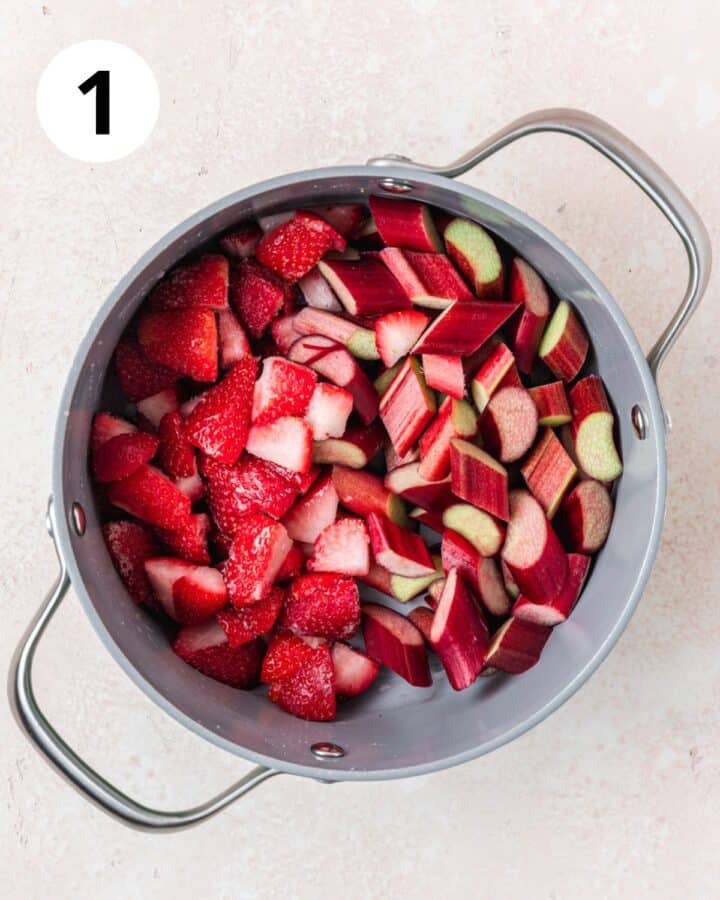 strawberries and rhubarb cut in 1 inch pieces in pot.