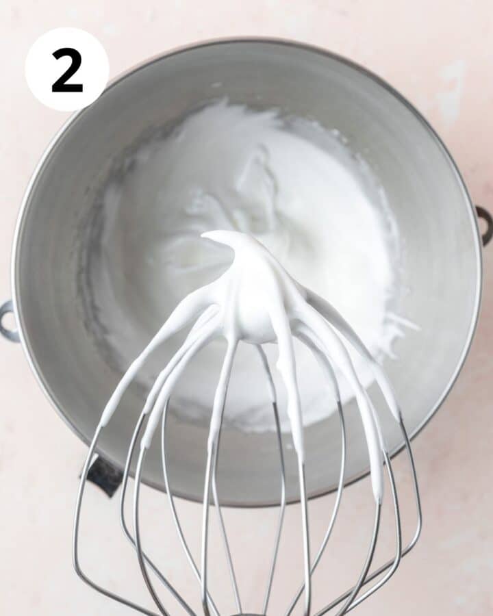 whipping egg whites to soft peaks.