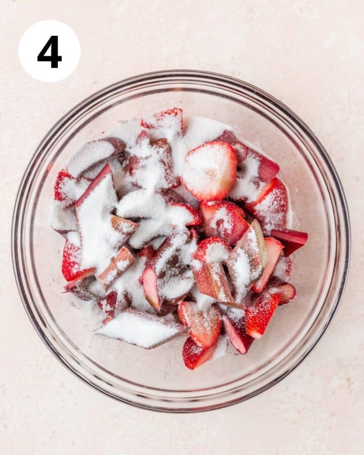 tossing rhubarb and strawberries in cornstarch and sugar.