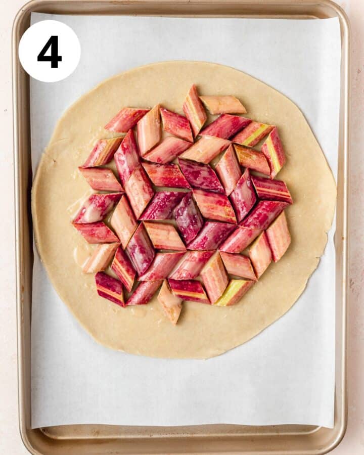 rhubarb arranged on pie dough.