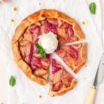 rhubarb galette with flaky pie crust topped with ice cream.