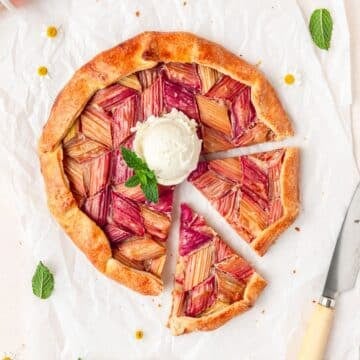 rhubarb galette with flaky pie crust topped with ice cream.