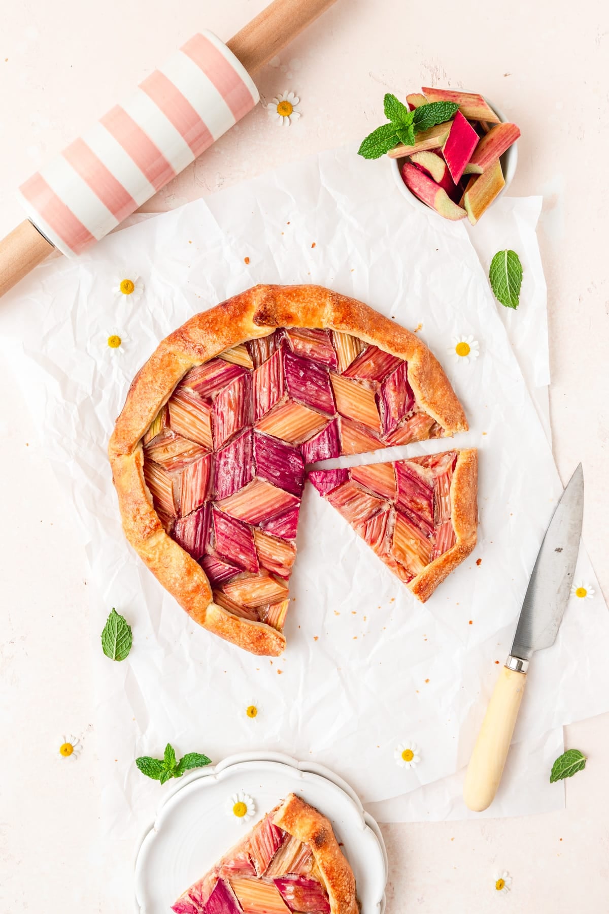 sliced rhubarb galette with flaky pie crust.