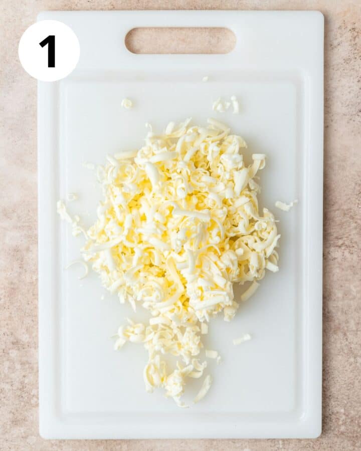 grated frozen butter on cutting board.