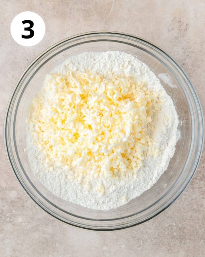 adding frozen butter to dry ingredients.