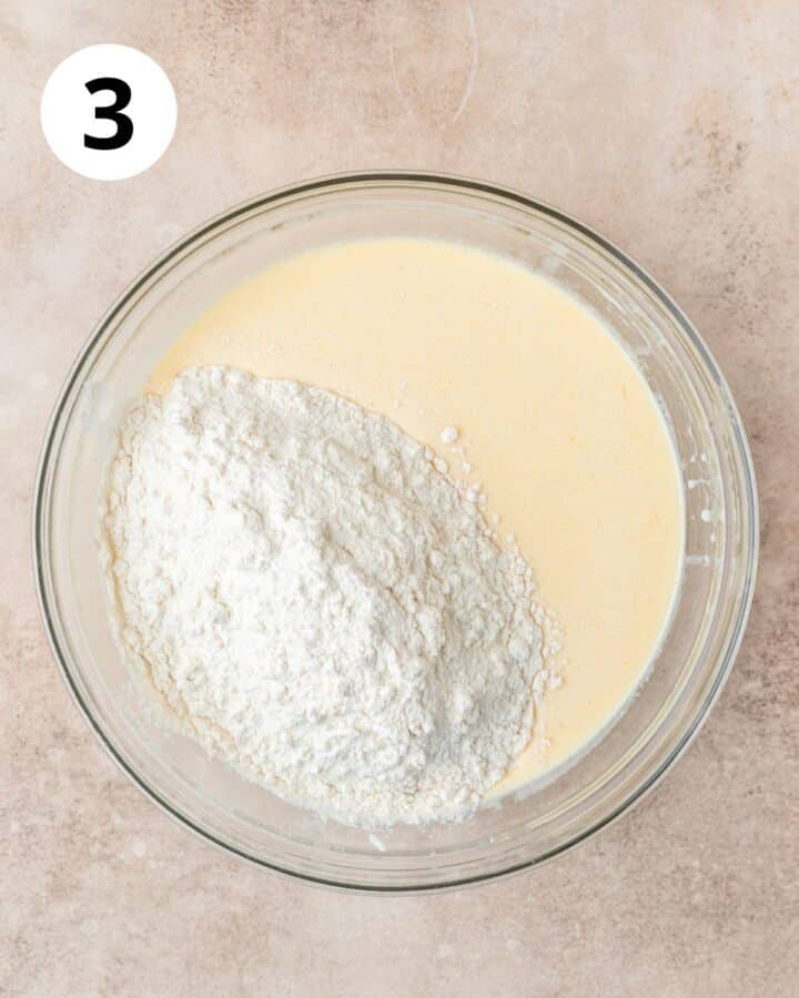 adding dry ingredients to wet ingredients.