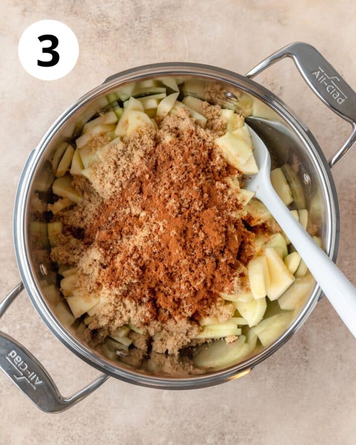 adding sugar and spices to apples.