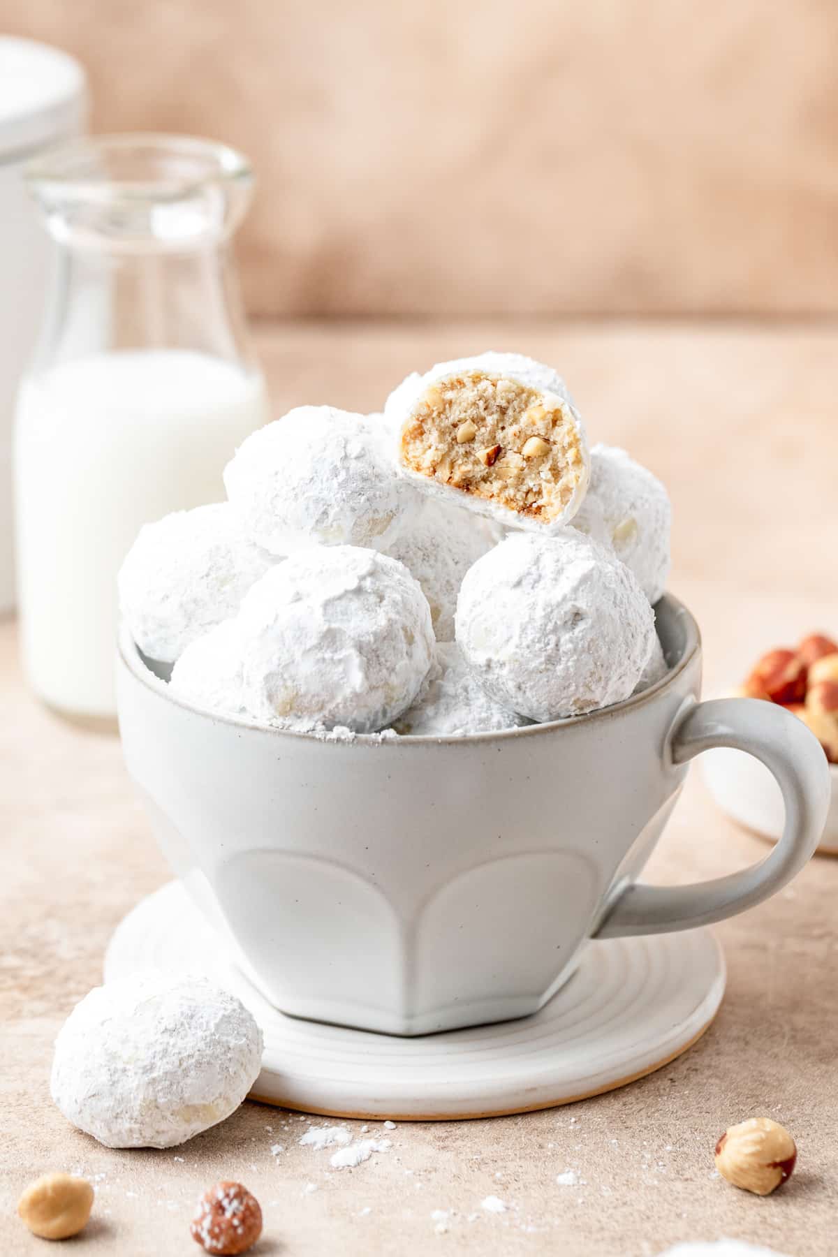 bowl full of hazelnut snowball cookies.