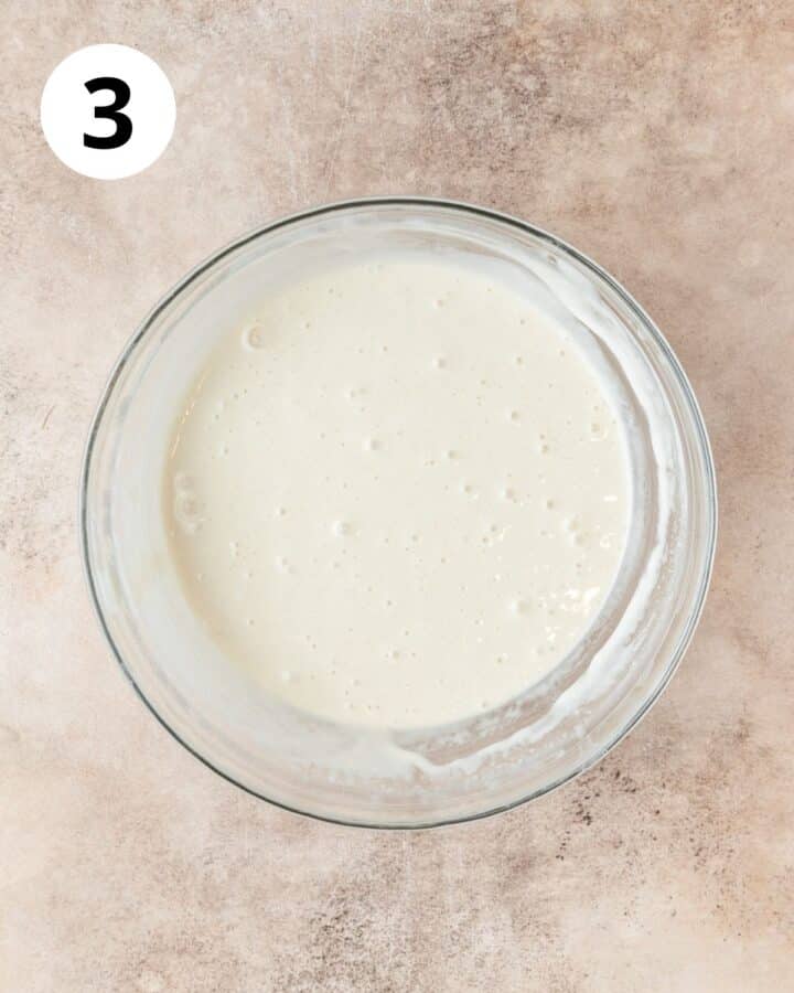 thinning out sourdough discard with water to make pancake batter consistency.