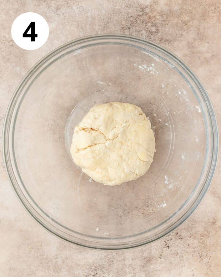 pie dough coming together in bowl.