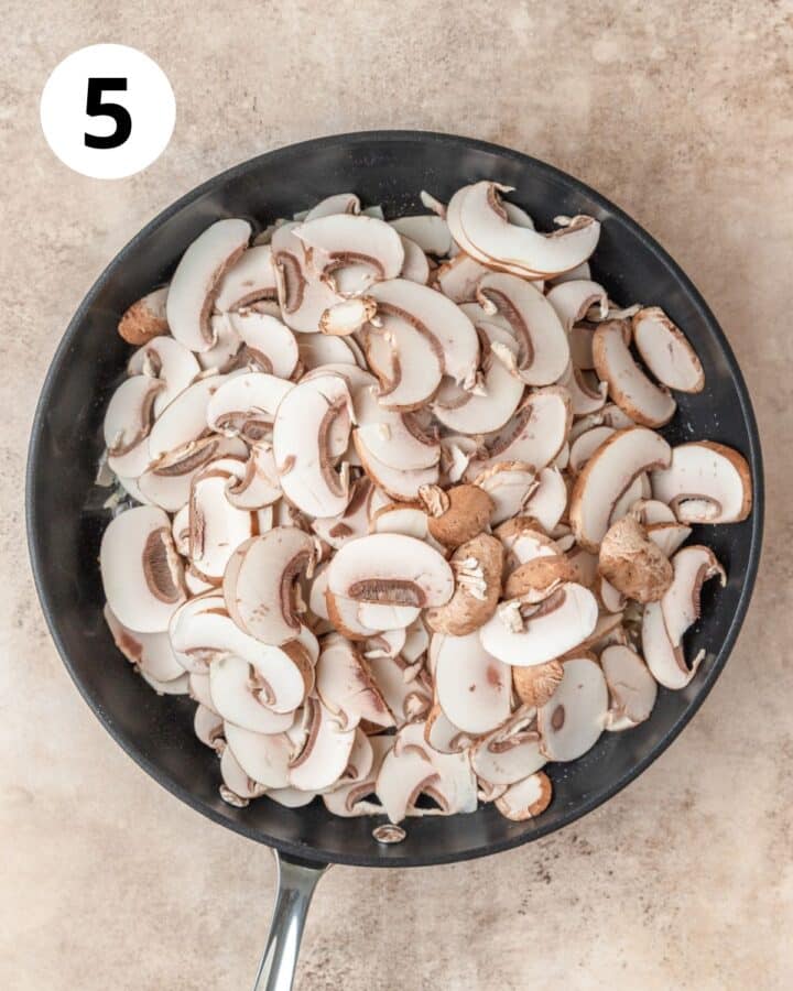 adding sliced mushrooms to pan.