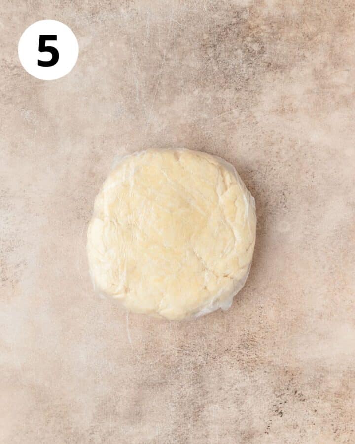 pie dough disk wrapped in plastic wrap to chill.
