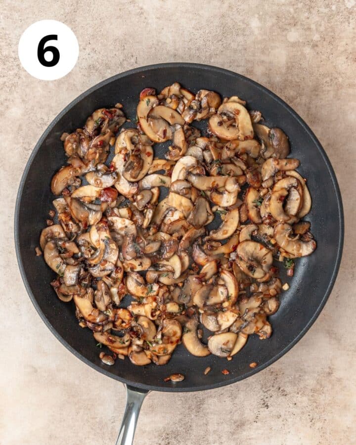 sautéed mushrooms in pan.