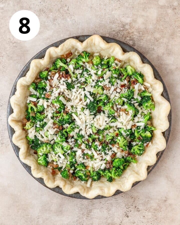 layering sautéed broccoli and white cheddar cheese in pie crust.