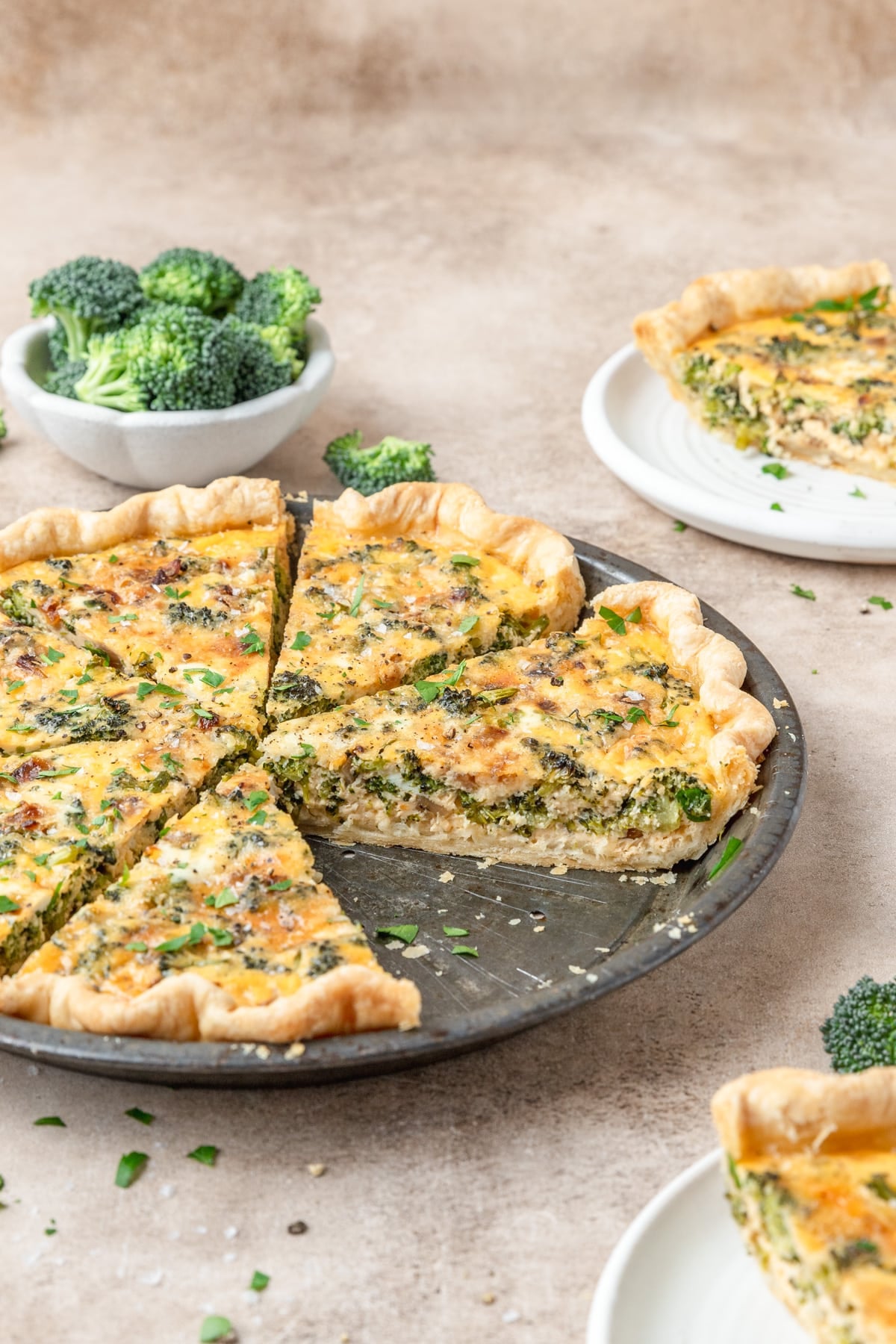 side view of broccoli cheddar quiche.