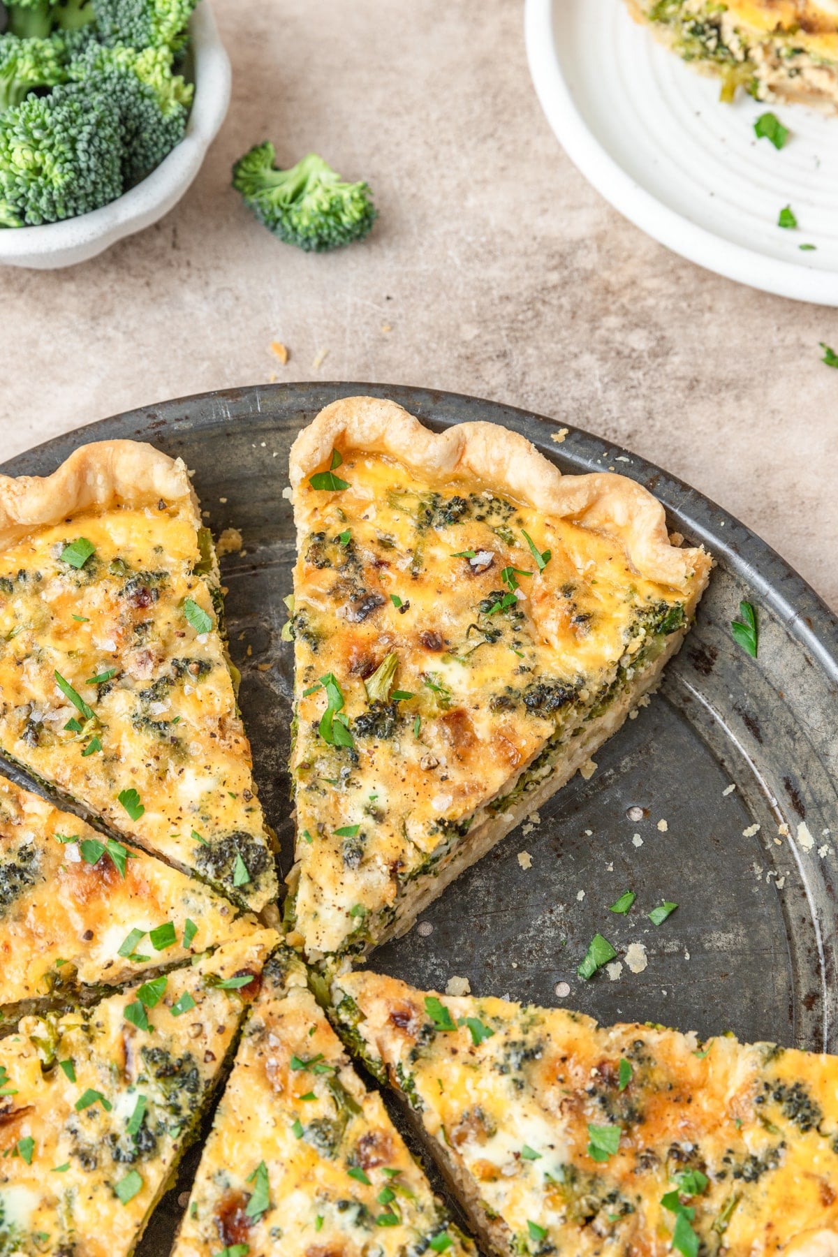 slice of broccoli white cheddar quiche.