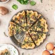 close up of spinach mushroom quiche with goat cheese.