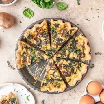 close up of spinach mushroom quiche with goat cheese.