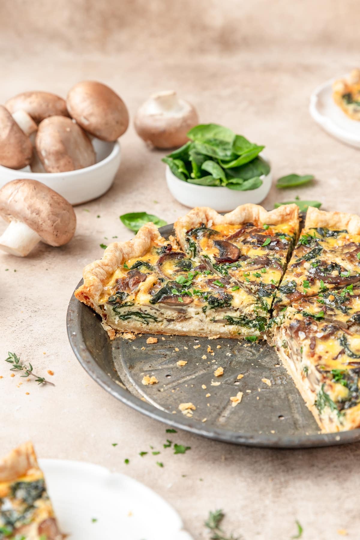 side view of spinach mushroom quiche.
